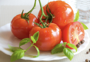 Red Delicious Tomatoes garnished with Basil